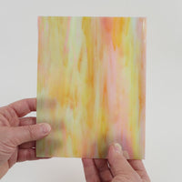 Video of the Peach Pearl glass plate in translucent pink, 15x19cm, held up and tilted to show its pattern and transparency