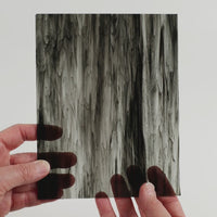 Video of the Marble Magic glass plate in black, transparent and marbled finish, 15x19cm, held up and tilted to show its pattern and transparency.