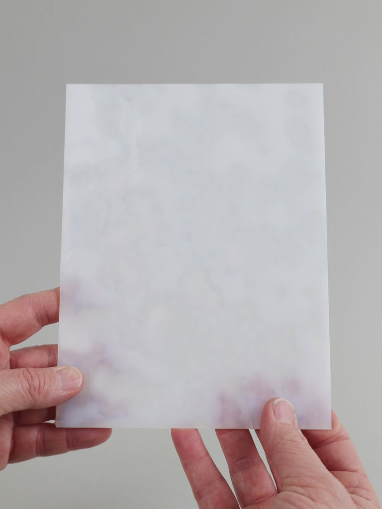 Video of the cloud glass plate in white semi-transparant, 15x19cm, held up and tilted to show its pattern and transparency